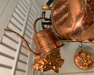 Copper molds, watering can, colander