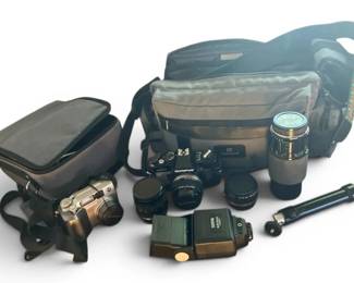 Two Olympus Cameras With Bags, Lenses, And Accessories