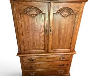 Solid Wooden Armoire With Carved Accents