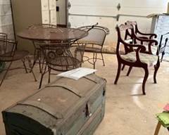 trunk and wrought iron patio set