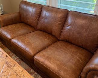 Beautiful brown leather couch. Leather has that distressed look 