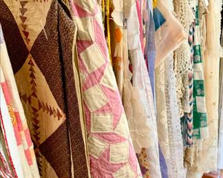 Lots of vintage quilts and quilt toppers perfect for quilt jackets.