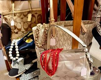 Michael Kors and Coach handbags.