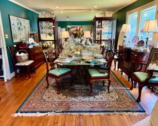 Vintage dining room full of silver, crystal, glassware.