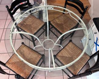 Circular dining table with four chairs