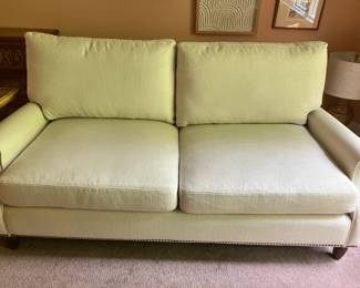 Kahli Sofa from Frontgate in Ivory. Very clean and comfortable. Near perfect condition except for a minor ding on the leg, which could be fixed -- it was mostly covered since purchase. This quality sofa retails for $3,800.