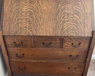 Vintage mission style oak drop-front secretary desk. Some damage on the front, but a timeless and beautiful piece
