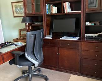 Desk with hutch and keyboard, office chair