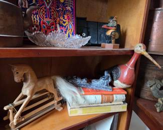 Wooden Rocking Horse ($50) , Soapstone Carving, Folk Art Handpainted Shore Bird, Pressed Glass Tray, Copper Teapot
