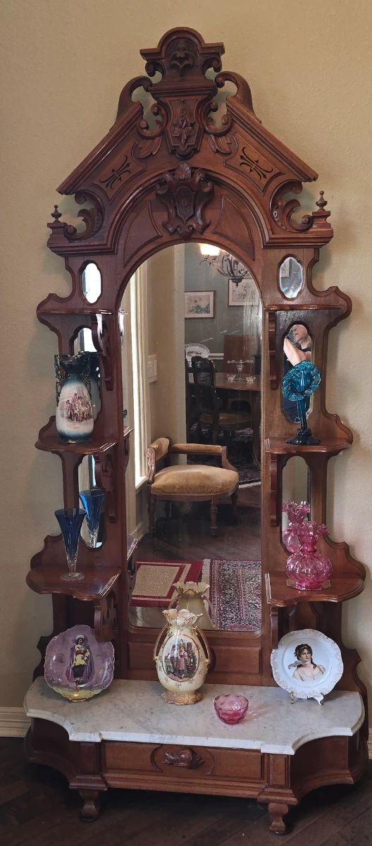 Beautiful House filled with beautiful things! More Pictures to come.This Victorian walnut etagere features a white marble top base and elaborate carvings on the crest.