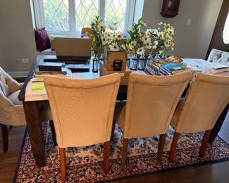 Dining table with upholstered chairs