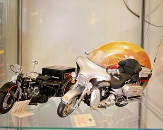 Franklin Mint Harley-Davidson Die-Cast Motorcycle Collection Additional premium Franklin Mint Harley-Davidson die-cast motorcycle models featuring exceptional detail, authentic styling, and collector-quality craftsmanship. Featured Items Include: Franklin Mint Harley-Davidson touring motorcycle with full fairing, saddlebags, and touring trunk Franklin Mint Harley-Davidson Servi-Car / three-wheel utility motorcycle Detailed chrome engines, spoke wheels, lighting, controls, and accessories Original collector display tags and documentation Indian Motorcycle collector plate featuring classic motorcycle artwork and sunset backdrop These highly detailed scale models are prized by motorcycle enthusiasts and Franklin Mint collectors for their realism and craftsmanship. Part of a larger Harley-Davidson, police, military, and Daytona Bike Week collection assembled by a Vietnam Veteran Marine and retired peace officer.