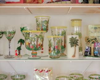 Hand-Painted Tropical Glassware & Coastal Accessories Collection Colorful Hand-Painted Tropical Entertaining Collection Beautiful collection of hand-painted glassware and coastal accessories featuring palm trees, tropical flowers, island scenes, and beach-inspired designs. Perfect for entertaining, decorating a Florida room, beach house, lake home, or tropical-themed space. Collection Includes: Hand-painted palm tree wine glasses Hand-painted tropical serving vessels and decorative glassware Set of four coordinating hand-painted candle holders Tall hand-painted carafe with matching drinking glass lid Tropical-themed decorative accessories Palm tree pillar candle Miniature tropical décor accents Specialty Collectibles: Motorcycle salt and pepper shaker set by Fred Bonn Coastal and tropical-themed novelty pieces Decorative island-inspired accents Each piece adds colorful coastal charm and is ideal for entertaining or display.
