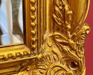 This  vintage gold mirror features an ornate baroque-style frame suitable for decorating a living room or entryway. Measures 60" W x 36" H 