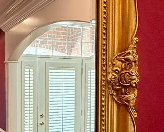 This  vintage gold mirror features an ornate baroque-style frame suitable for decorating a living room or entryway. Measures 60" W x 36" H 
