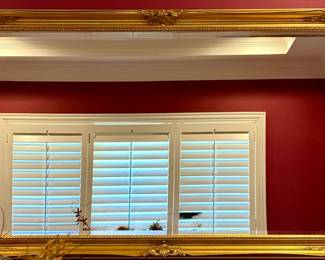 This  vintage gold mirror features an ornate baroque-style frame suitable for decorating a living room or entryway. Measures 60" W x 36" H 