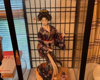 #45 doll dr asian doll in case 13x10x31 $ 30.00