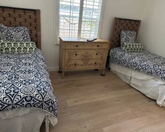 Twin bed with plantation weave headboard