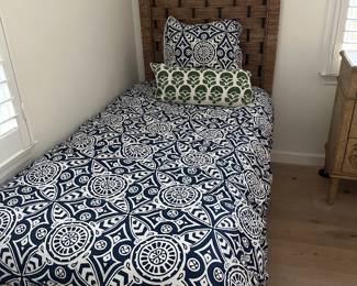 Twin bed with plantation weave headboard