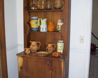 primitive hutch - variety of pitchers/ceramics