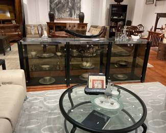 Contemporary Black Lacquered Credenza / Sideboard Description: A sleek, modern four-door buffet featuring a satin black lacquered finish, oversized industrial-style cylindrical door handles, and clean plinth base styling. Estimated Dimensions: Width: 72" Depth: 18" Height: 34"