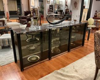 Contemporary Black Lacquered Credenza / Sideboard Description: A sleek, modern four-door buffet featuring a satin black lacquered finish, oversized industrial-style cylindrical door handles, and clean plinth base styling. Estimated Dimensions: Width: 72" Depth: 18" Height: 34"