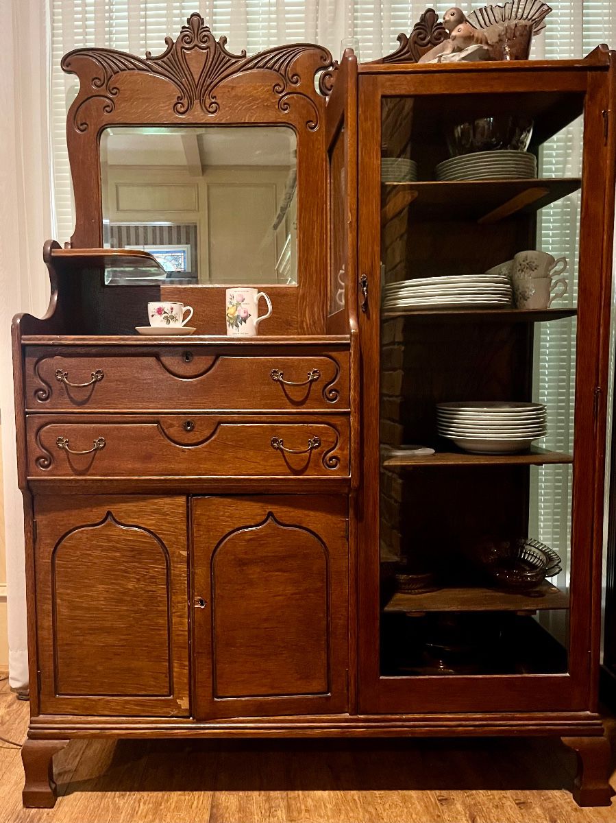 Antique oak side-by-side cabinet with mirrored hutch and curio cabinet. Late 19th or early 20th century.