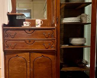 Antique oak side-by-side cabinet with mirrored hutch and curio cabinet. Late 19th or early 20th century.