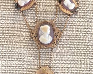 4 Cameo Victorian Edwardian Cameo Necklace.  Lovely antique shell cameo necklace, circa 1890 to 1915. The necklace opening is 16". The top two cameos also have a small seed pearl. The center cameo is 1 5/8" long.