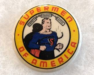 Rare 1 1/4" celluloid premium insert Superman pin back button from the Supermen of America, the first official comic book character fan club. It was formed in 1939 by DC Comics (then National Comics) and features the iconic image of Superman and the slogan "Strength Courage Justice" from the back cover of the Superman #1 comic, illustrated by Joe Schuster. Excellent condition.