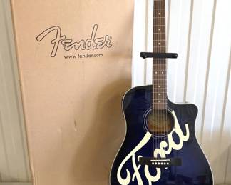 2003 FENDER Ford Motor Co Sonoran Acoustic Guitar. A special limited edition guitar by Fender in the style of with the FORD Motor Company Logo on the front. These guitars were made as promotional items for the "Garth Brooks Built Ford Tough" campaign for the launch of the new Ford F-150 truck. They were not sold in retail stores. They were given away as promotional items in radio contests or by Ford dealerships. Like new in box.