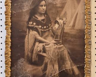 Early photograph of a Sioux Indian woman with a cradleboard