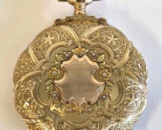Antique 17 jewel, 16 size stem set Hamilton pocket watch in an extraordinary and ornate 14 karat tricolor gold box hinged hunter case. The intricate gold designs are different on each side. The watch has an unblemished Montgomery Dial and the works are adjusted to 3 positions. The serial number is 1,241,470, dating it to 1915. It is running and keeping good time.