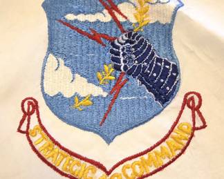 Cold War Era US Strategic Air Command Scarf. This 28" square hand rolled edge rayon scarf (ascot) would have been worn by combat crew members of the B-52 Stratofortress and B-47 Stratojet, as well as by SACE Elite guard units (Elite Security Forces) as part of their uniforms. The insignia on the scarf was adopted in 1951. The scarf dates to the height of the Cold War in the 1950s or 60s.