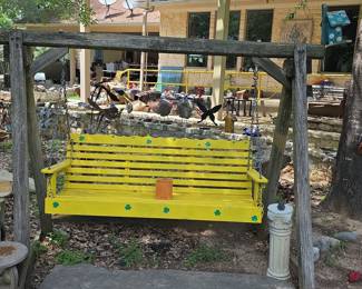 Yellow Wooden Swing with Shamrock Decorations