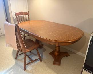 . . . oak table and two chairs