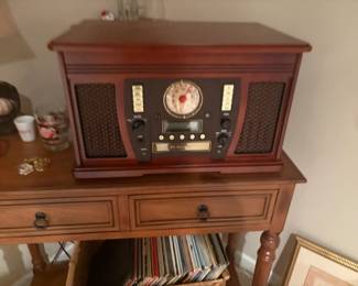 . . . multimedia center: turntable, radio, CD player