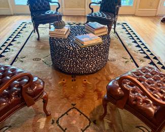 Set of four leather tufted English armchairs