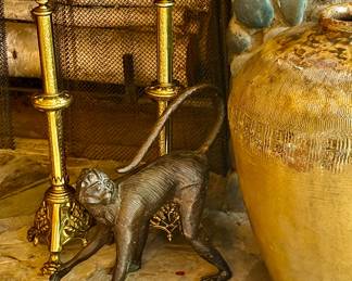 Antique altar sticks and vintage bronze monkey