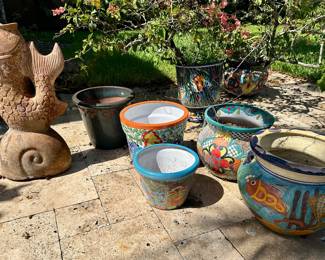 The fish statue, two pots on the right, and orange pot  are sold.