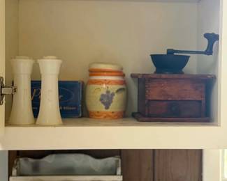 THE WHITE SPICE RACK HOLDS A POPULAR SPICE JAR BEHIND THE PAPER