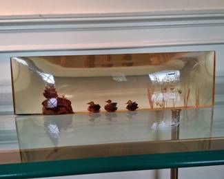 Resin ducks in a pond decoration piece