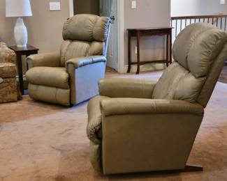PRESALE - $300 EACH - TWO MATCHING PINNACLE ROCKING RECLINING LA-Z-BOY RECLINERS...PURCHASED 2022...Features  Plush, ultra-comfortable recliner Padded rolled arms Chaise seat and legrest Padded, channel-stitched tall back maintains shape and support Rocks and reclines for total comfort Personalize your recline with 16 different back positions Convenient side-mounted handle lifts the legrest into 3 supportive, safely locked positions Chair can be gently rocked when the legrest is not engaged Chair back can recline independently, without activating the legrest High grade foam seat cushion maintains its comfort and appearance Premium grade leather