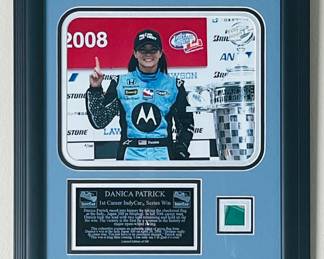 DANICA PATRICK 1ST CAREER INDY CAR SERIES WIN JAPAN 300, 2008 PHOTO PLAQUE, PIECE OF GREEN FLAG, LIMITED EDITION OF 300 PIECES FIRST VICTORY BY A WOMAN IN THE HISTORY OF MAJOR OPEN-WHEEL RACING, INDY CAR CERTIFICATE OF AUTH. 17"X15"