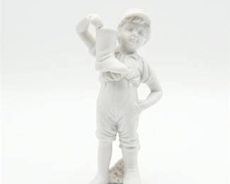 Bisque Porcelain Figurine of Boy Holding a Boot