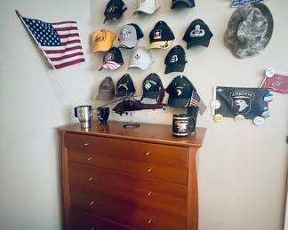 Dresser with vintage military that may stay with family but chance of selling