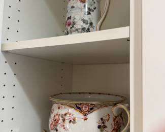 Ironstone  features a classic Imari-style floral pattern  stands on ornate tripod feet