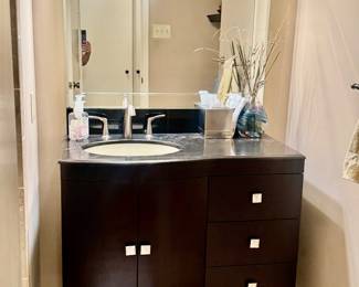 Bathroom vanity complete with sink and faucet