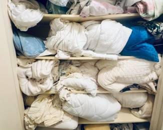 Linen closet organized and full