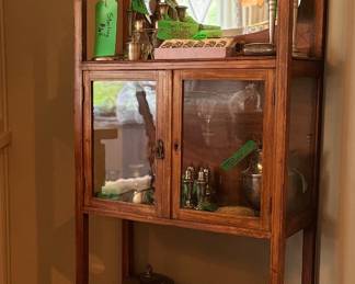 Glass front china hutch with sterling finds
